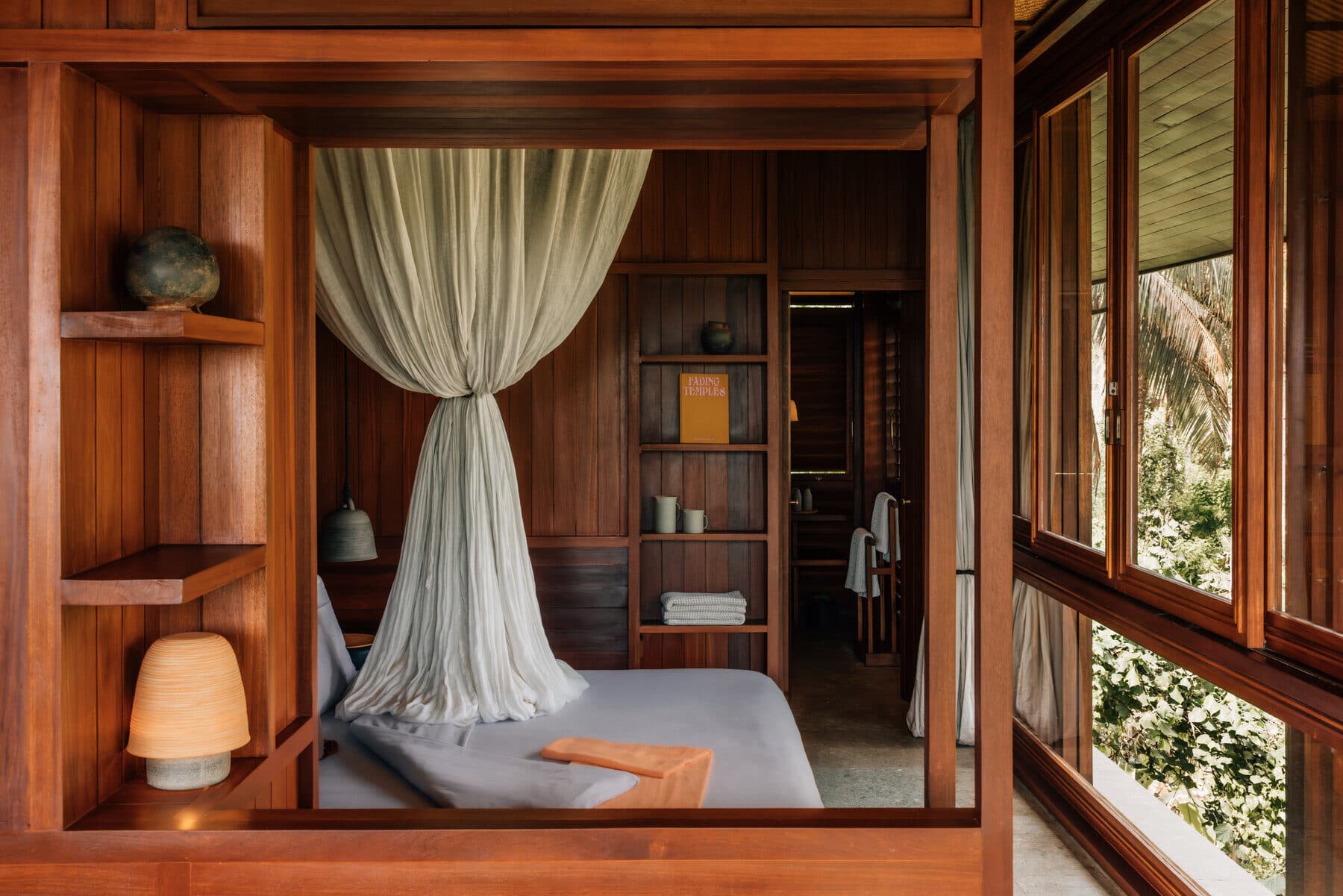 Wood-panelled bedroom at MAY Hotels property