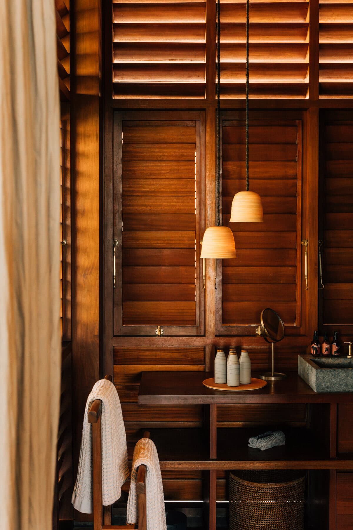 Wood-panelled bath detail at MAY Hotels property